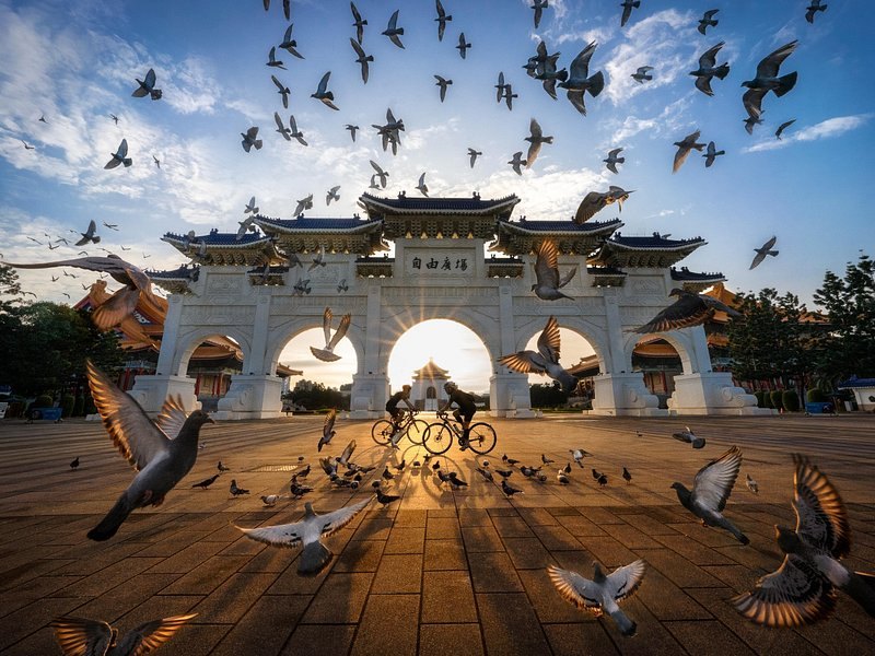 Pigeons rising in front of the Liberty Square gate at Chiang Kai-shek Memorial Hall