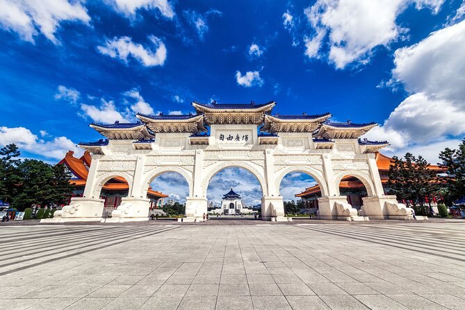 The white Liberty Square gate at Chiang Kai-shek Memorial Hall under a blue sky